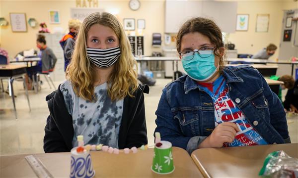 students work to build a bridge